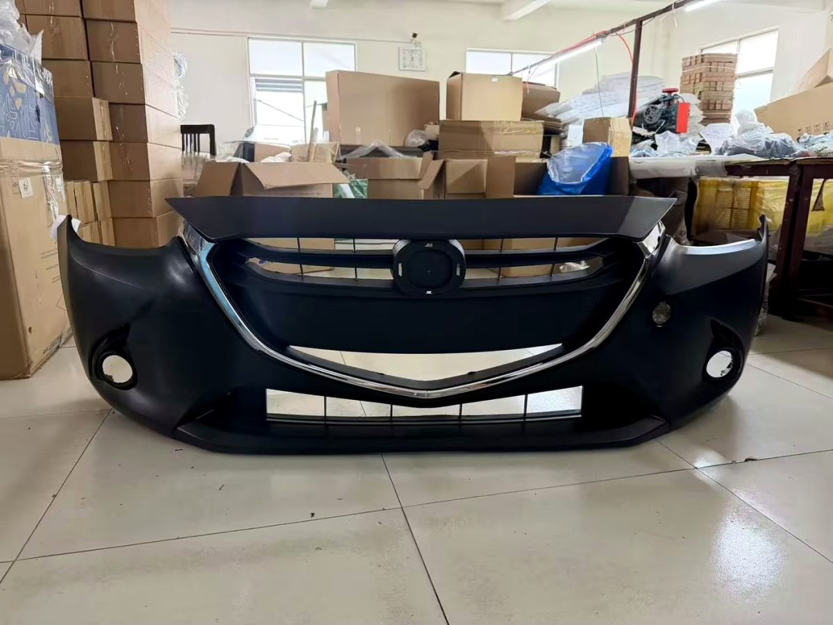 front bumper assembly Mazda Demio